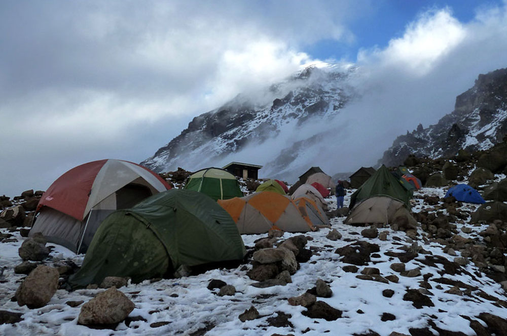 Barafu camp at 4673m - climbers checking gear before final summit push